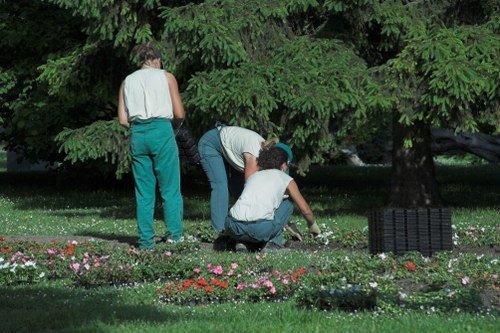 Trained landscaper using safe working practices in Purley